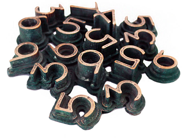 Bronze wall sculpture "Nerone" by Paolo Grassi, green patina version with polished numerical elements forming an abstract composition