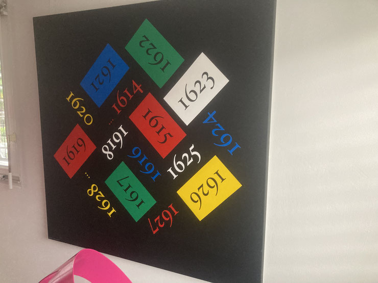 Side view of conceptual artwork 60 by Paolo Grassi, painted numbers in coloured squares on black background