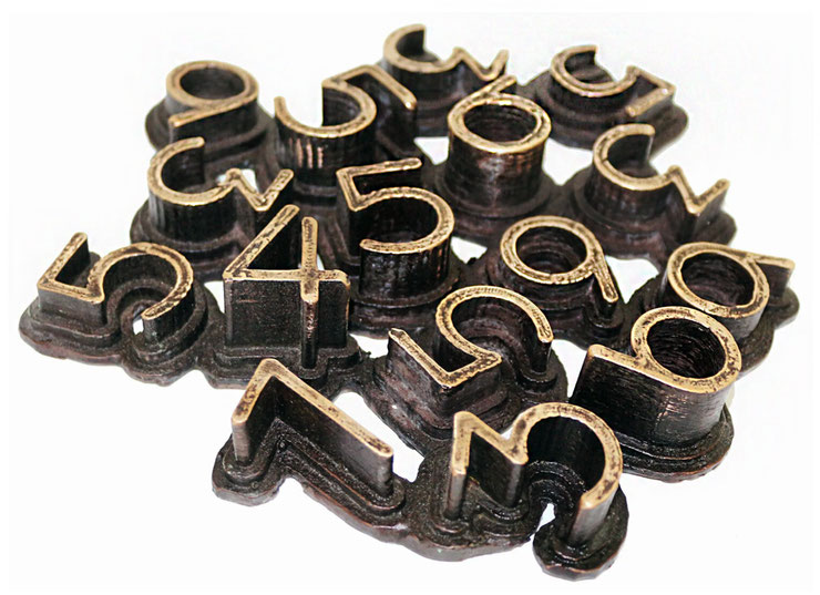 Bronze wall sculpture "Nerone" by Paolo Grassi, brown patina version with polished numbers forming a compact abstract cluster