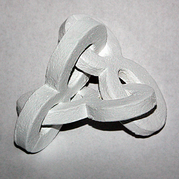 White plaster model of Paolo Grassi's sculpture "888", showing early form development and interlaced shapes
