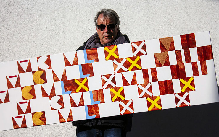 Artist holding the painting Romanus III – abstract composition with Roman numerals in Pompeian red, gold, and light blue
