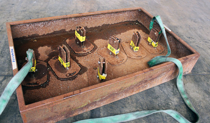 Empty base of the sculpture Piera by Paolo Grassi, showing numbered anchor points and modular fixing system before installation