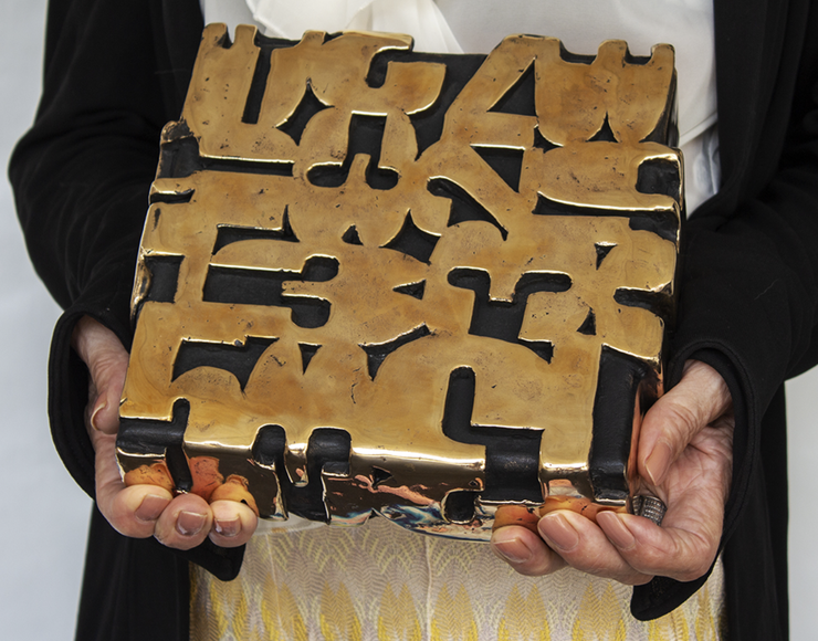 Paolo Grassi bronze sculpture Box held in collector’s hands, highlighting human scale and intimacy