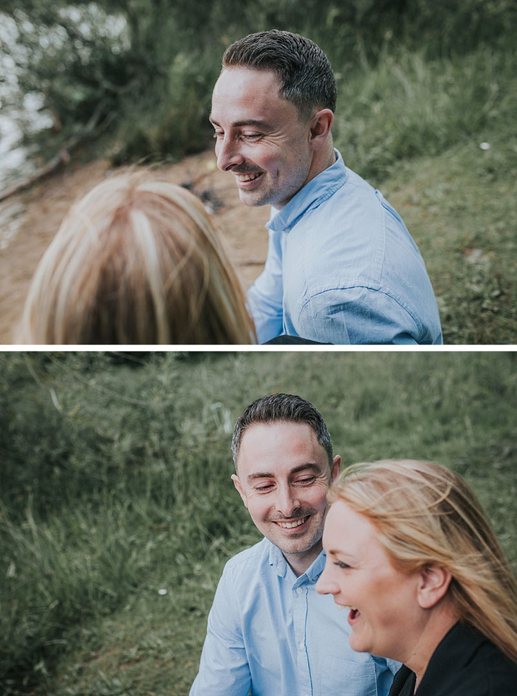 A couple smiling and laughing whilst having engagement photographs taken