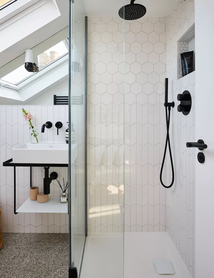 bathroom renovations with matt black fittings and mixers and white small wall tiles and waterproofed floor