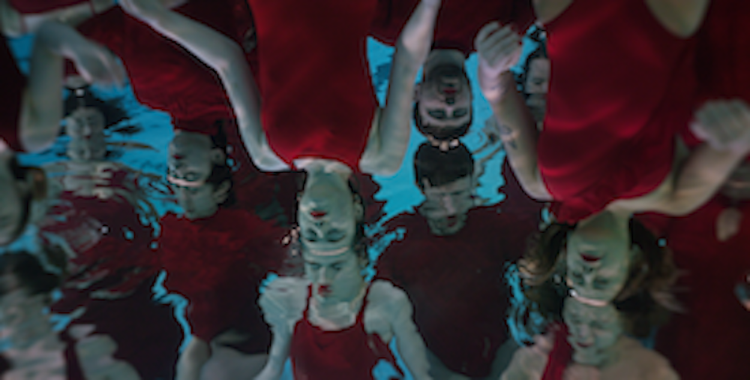 Two-screen video art installation Liquid Tongues by Daniel Kotowski and Bogna Burska, featuring hearing and Deaf performers translating whale echolocalizations at the Polish Pavilion, Venice Biennale.