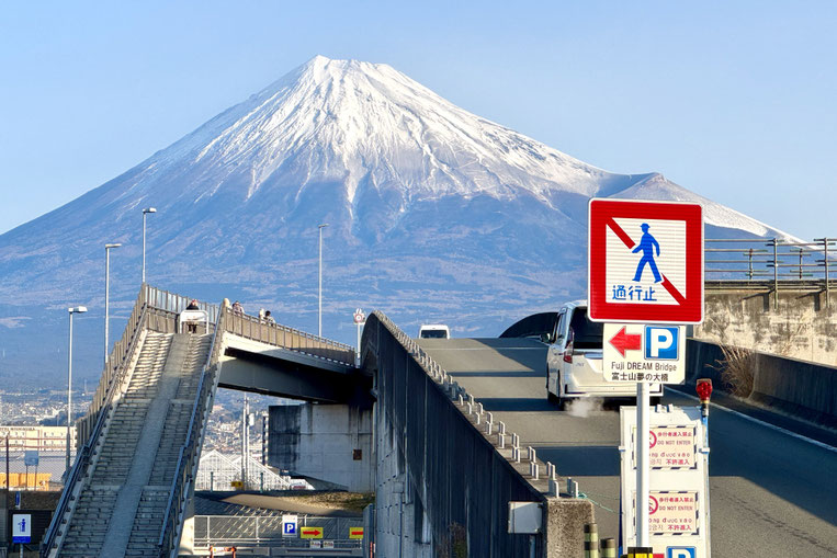 Fujisan Yume no Ohashi Bridge with Mt. Fuji rising in the background in Fuji City, Shizuoka.