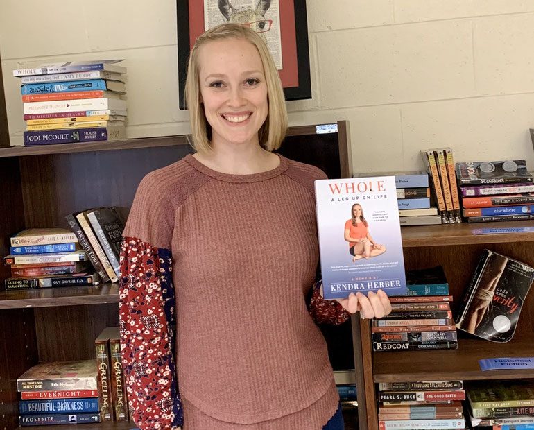 Kendra with a copy of her biography 'WHOLE: A Leg Up On Life' (picture courtesy of Kendra Herber)