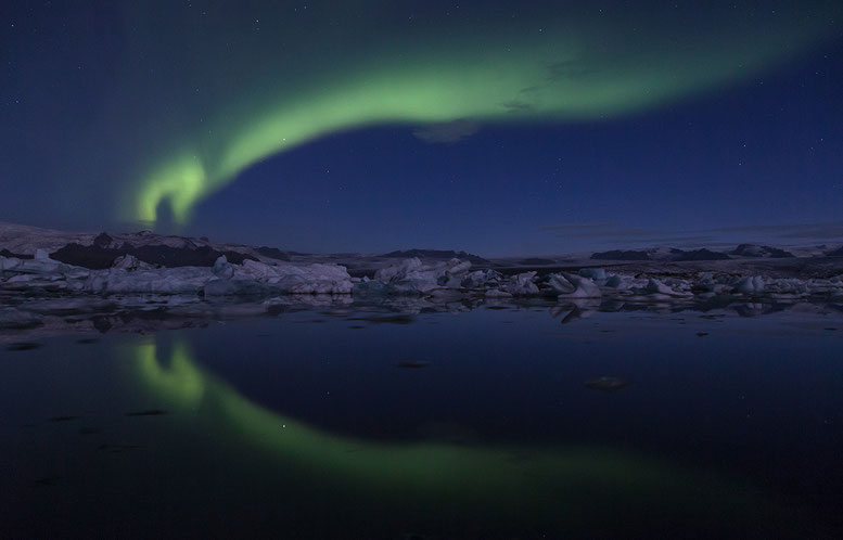 Jökulsarlon glacier lagoon with the Vatnajökull glacier ice and reflecting Aurora Borealis, Iceland, Scandinavia, Europe