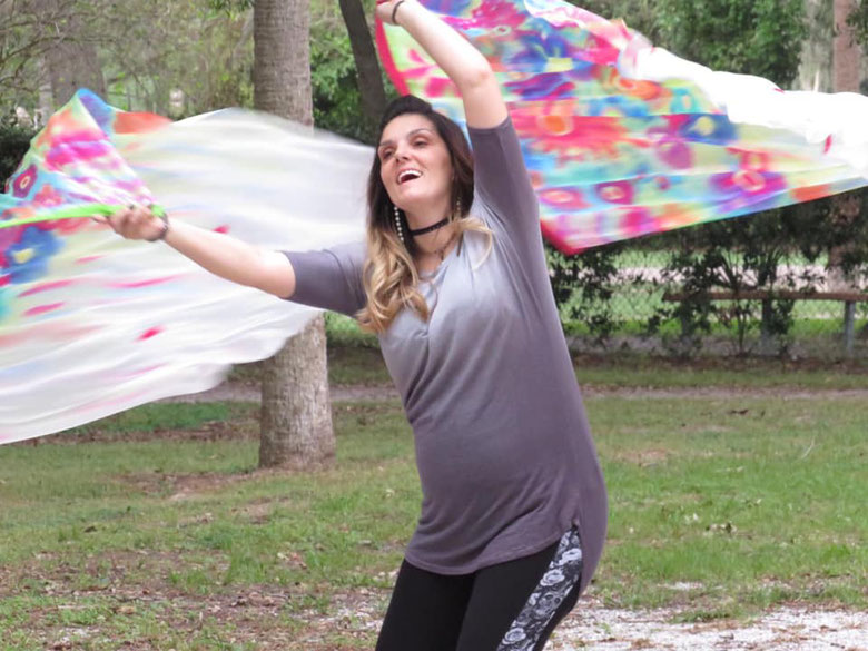 Woman dancing with colorful flags