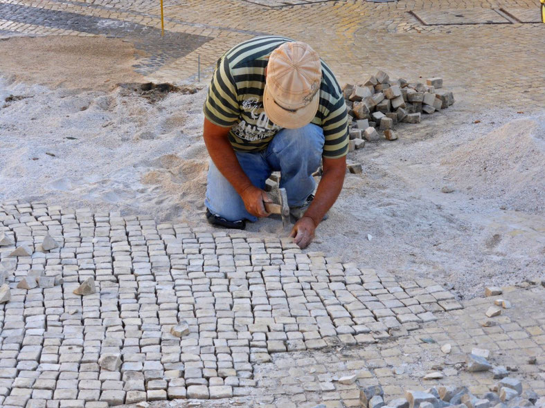 Craftsman repairing the pavement