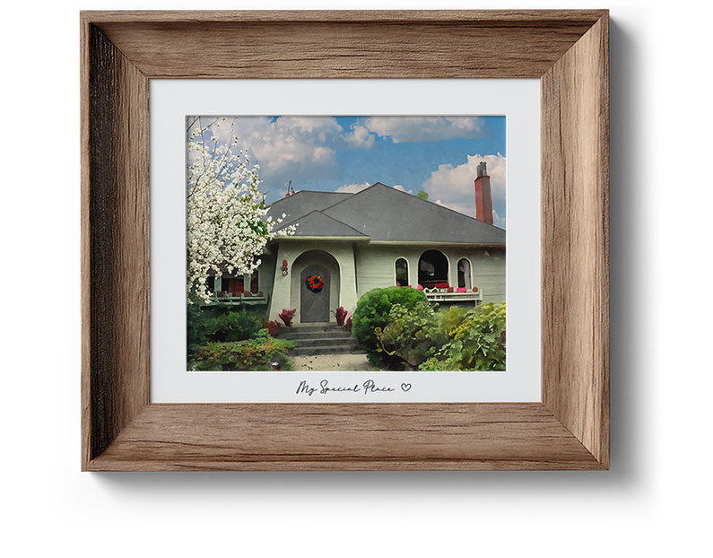 Brown wooden frame with digital painting of a house that looks like watercolor painting