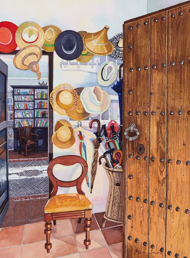 A collection of sun hats at old Andalucian finca.