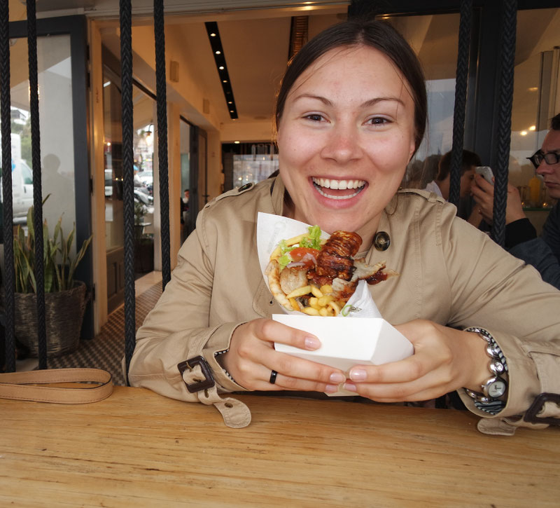 Laura happily eating a Pita