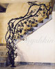 Wine cellar sculptural railing, metal art that grows from the basement floor and wraps around the steps up to the second floor. This piece of art is called "Lady Bug", becouse iron made Lady Bug, was set amoung the leaves by Oleg Shyshkin, the artist."  