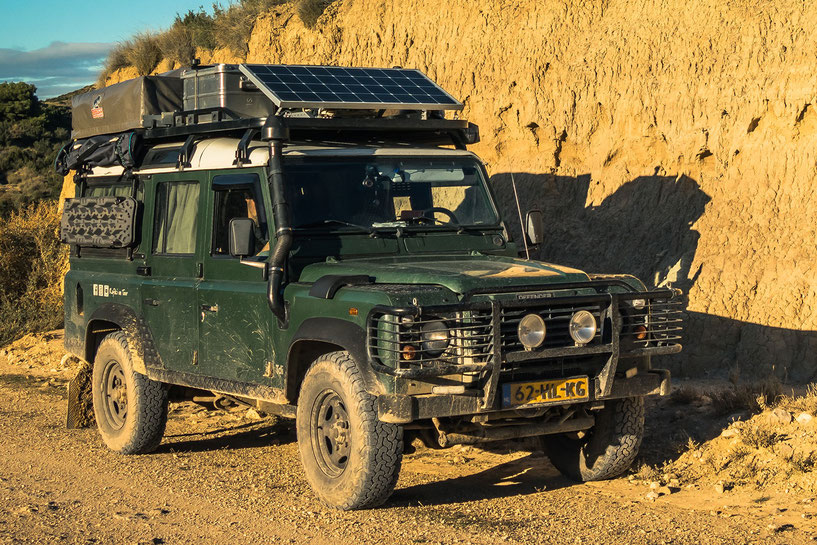 Tembo roof rack on our overland travel Land Rover Defender with solar panel and rooftent