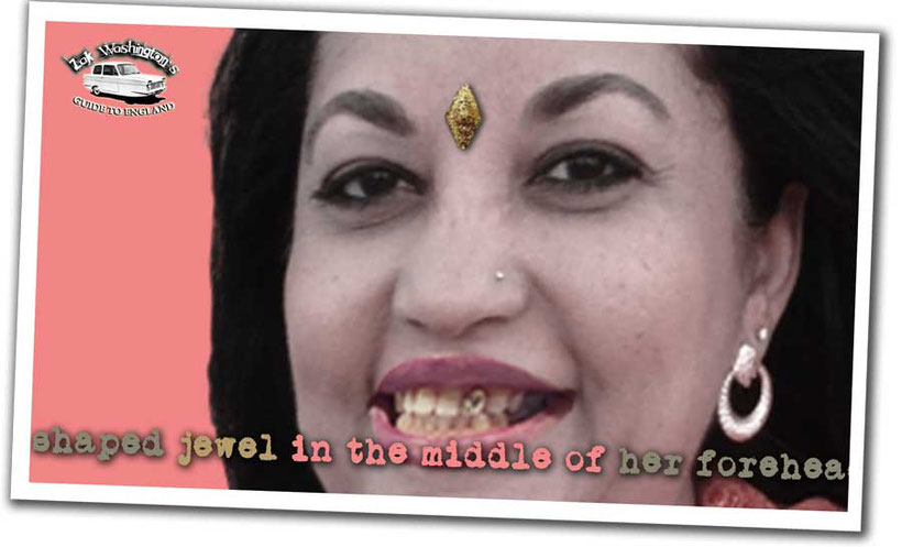 British culture: photo of an Indian woman with a jewel in her forehead and a gold tooth. 