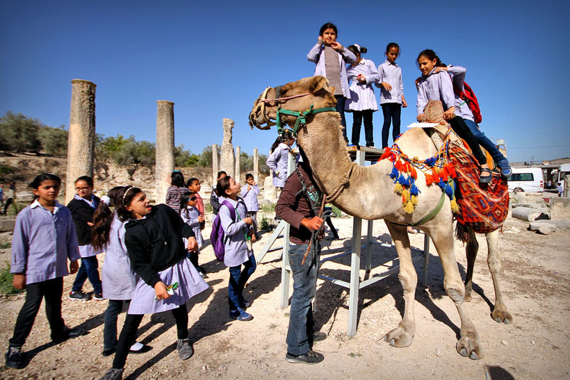 Shortly after the girls were offered to ride a camel, so eventually they lost any interest on taking more images with me. It's OK. © Sabrina Iovino | JustOneWayTicket.com