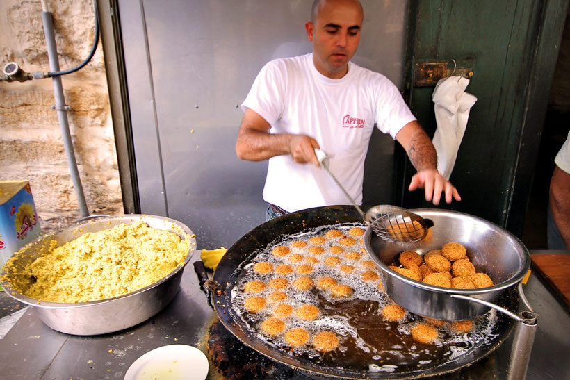 Lunch time in Bethlehem, Arab Style. Hot Falafel at Afteem Restaurant. © Sabrina Iovino | JustOneWayTicket.com