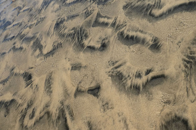High tide is coming across the sand dunes of Maspalomas, Gran Canaria.