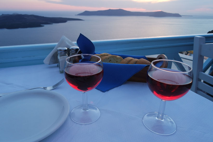 sunset dinner on Santorini Fira wine glasses