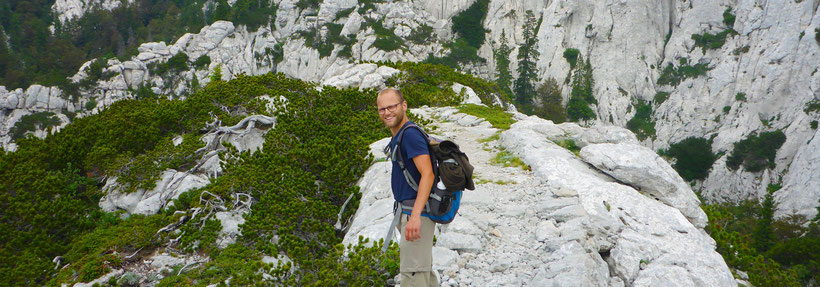 Hiking the Premužić path, on a karst rock formation in the Northern Velebit National Park