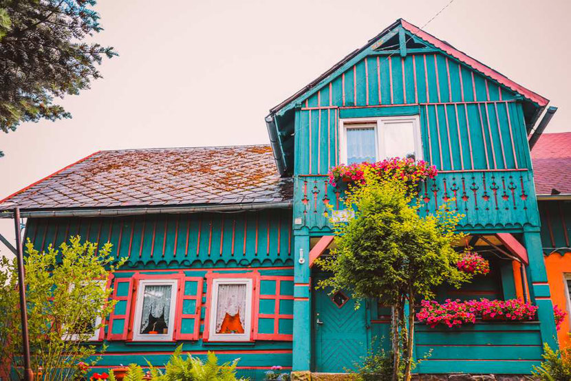 beautiful colorful cottage with unique decorations