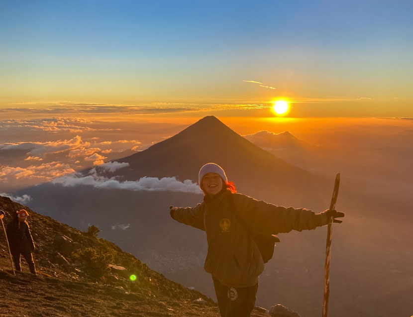 a person hiking on a sunrise during her volunteering trip to Guatemala 