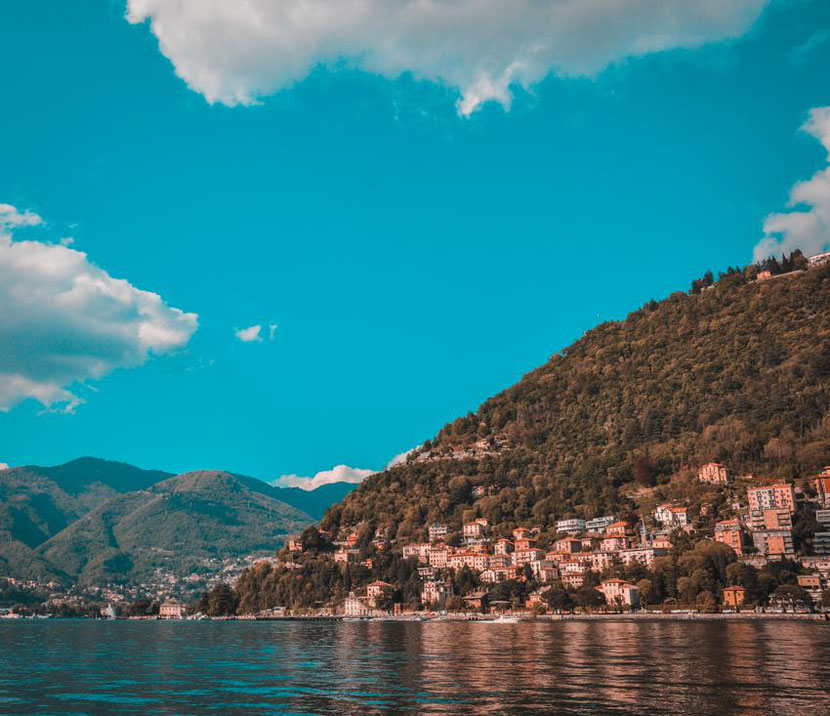 Beautiful mountains and houses on Lake Como in Italy. It's easy to reach it from Milan. 