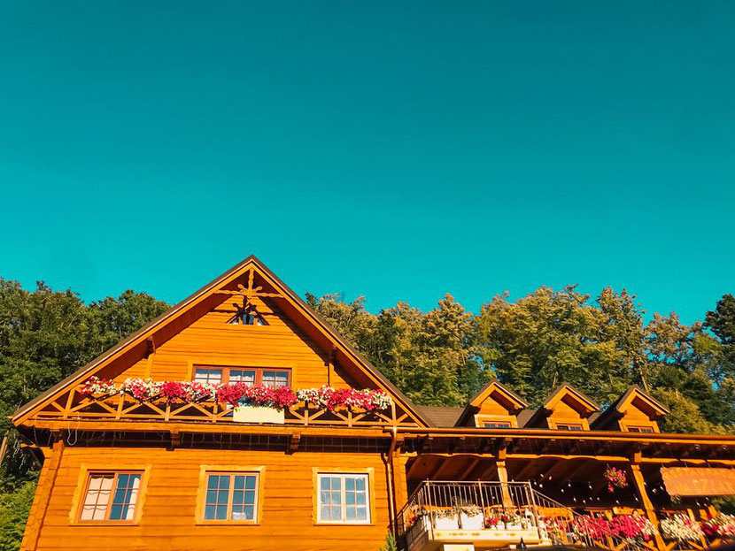 amazing wooden cottage decorated with flowers