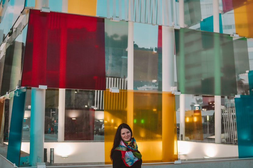 a colorful cube that houses the Center Pompidou in Malaga 