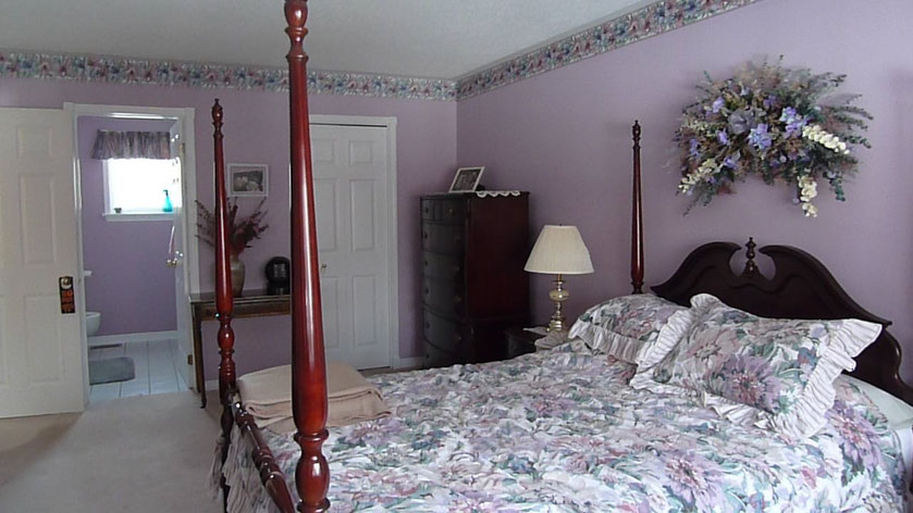 Floral wallpaper border, floral valance and bedspread and dried flower arrangement on the wall were great in the 90's but will not appeal to today's buyer.