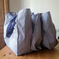 Sur l'image, trois grands sacs pour le transport et rangement de grands rideaux de fond de scène. Réalisation sur commande par la maison de couture Fil et Paillettes.
