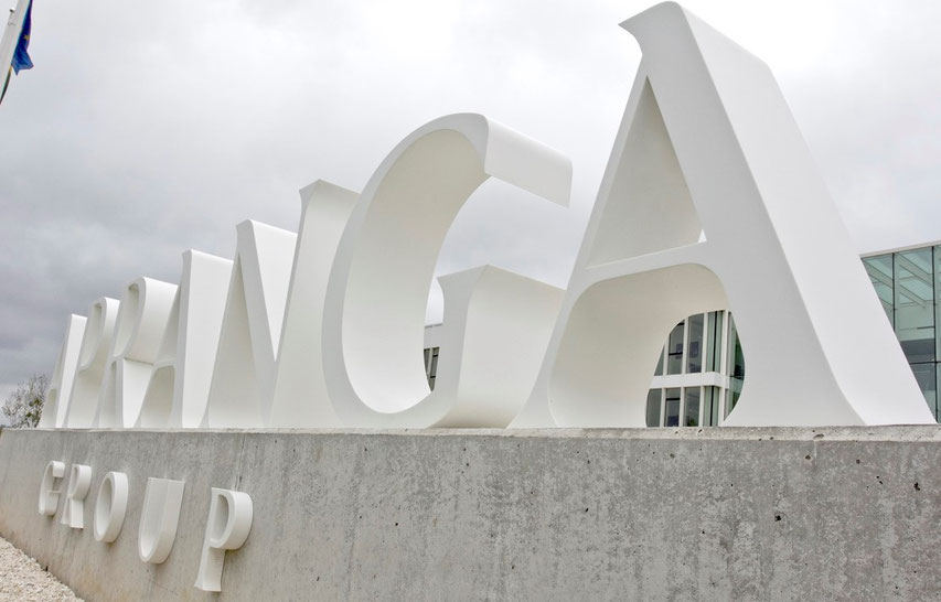 Logo of Apranga company in Vilnius next to the office building is fabricated from Corian Glacier White acrylic surface