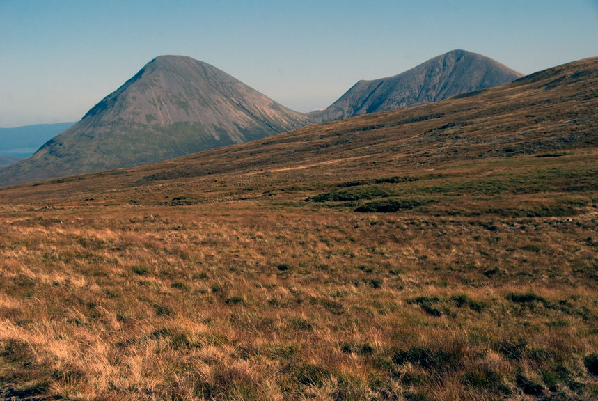 The Red Hills (Glamaig 775m and Beinn Dearg Mhor 731m) adjacent to the Cuilleans on Skye. These were formed by granitic intrusions and have left a very different form of mountain after glaciation.  