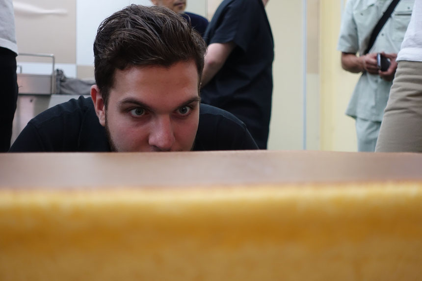 Luca of Team Canada examining the depths of the exotic Castella Cake