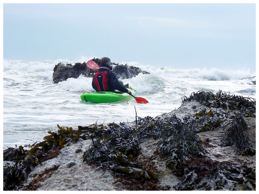 Playing in the surf along the Welsh coast