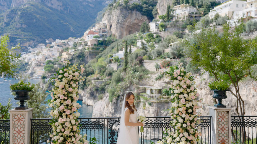 photo of the bride with Positano in the background