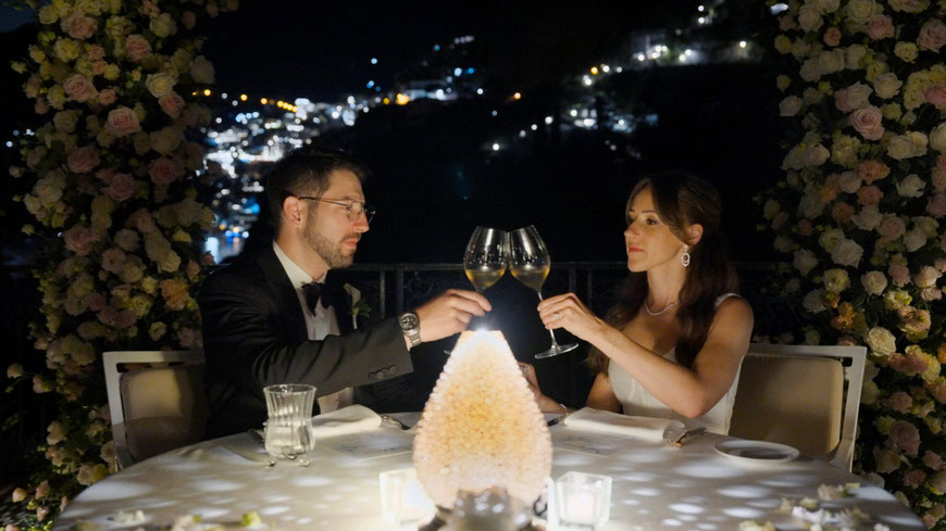 A toast at the candlelit table