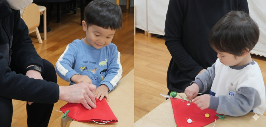 2歳児が、クリスマス会の製作で、ひもを使って帽子をつくっています。