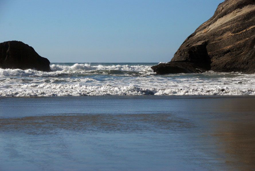 The wild Tasman Sea on a calm and delightful late afternoon at Wharariki Beach.