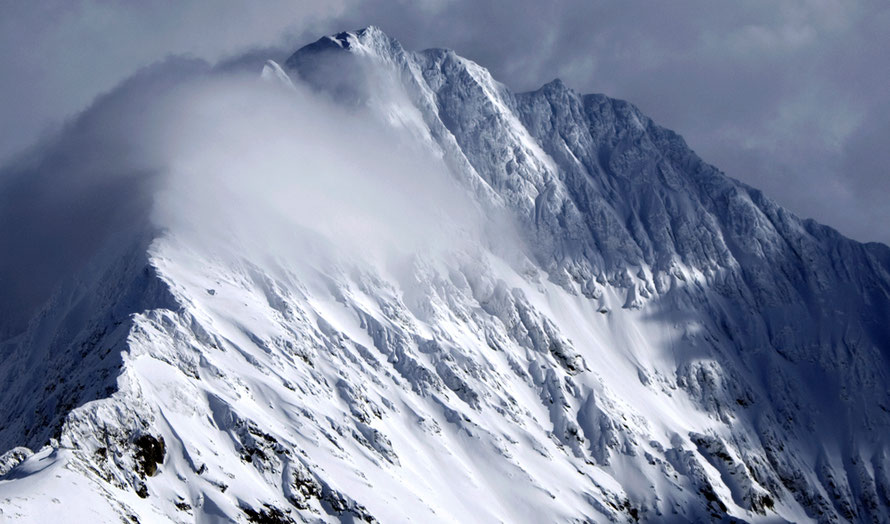 The sweeping summit arête of Stortinden (1512m) from the north-west near Jaegervatnet.