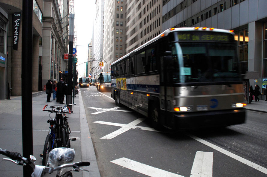 Coaches taking the Financial District workers home, Broadway New York.