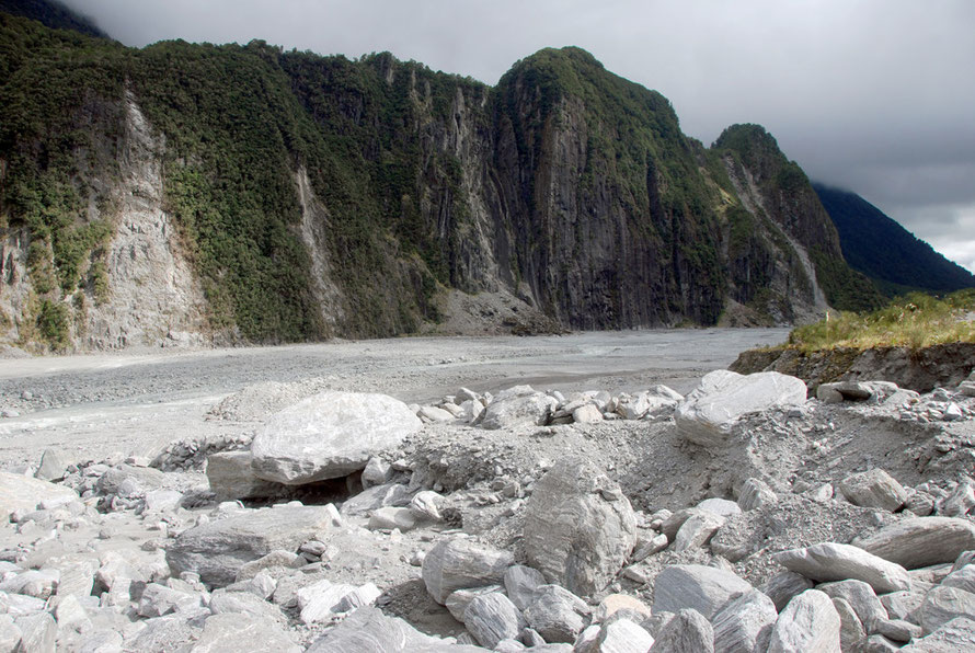 Another view of Cone Point with its many rockfall scars and the barren landscape left by a mountain torrent in the foreground.