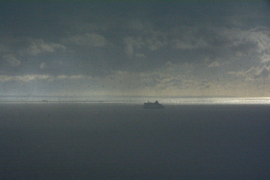 Curtain of hail and snow with the sun still shining on Boulogne. 