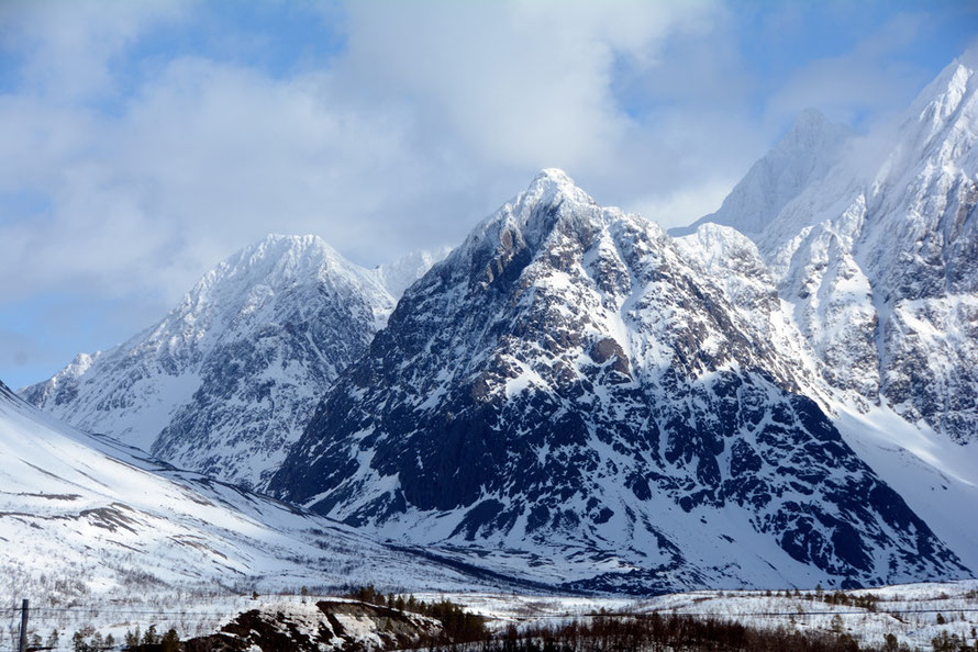 The striking black rock of the gabbro on Litle Lenangstinden (1100m). The Black Cuillin's on the Isle of Skye are also formed of Gabbro. Polished gabbro is often sold as as 'Black Granite''.