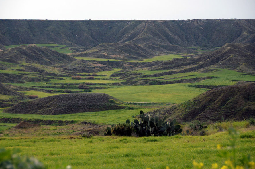 Flat topped land  eroded down into semi-terraced fields by milennia of cultivation near Tseri.