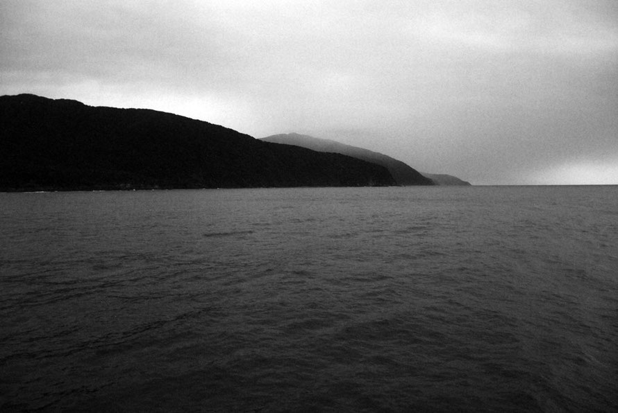 Early morning light at St Annes Point at the mouth of Milford Sound looking south. Anita Bay, one of the sources of tangiwai (Bowenite pounamu/greenstone), is on the far left of the picture.