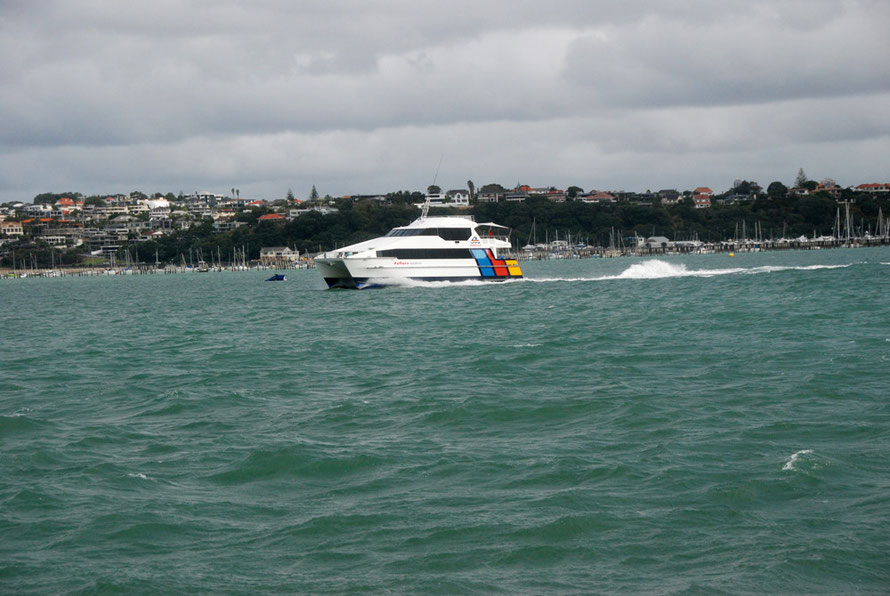 The Waiheke catamaran ferrry making speed along the South Shore of the Motokorea Channel as it heads into the Hauraki Gulf.