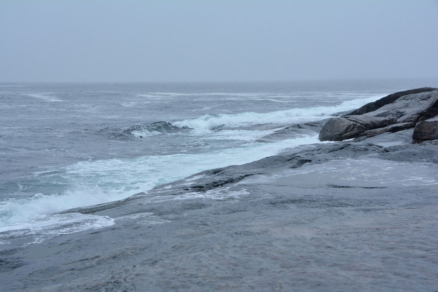 The brilliantly clear waters of the north west Atlantic warmed by the Gulf Stream on the island of Senja at Tungeneset. 